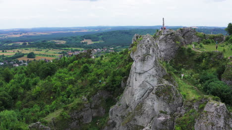 Drone-shot-of-rock-climbing-in-famous-Zborow-Mountain-surrounded-by-natural-forest