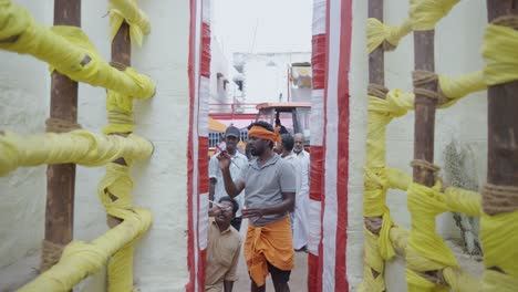 Wide-shot-of-the-work-of-painting-the-arena-and-setting-up-the-gallery-is-going-on-in-Alanganallur,-Madurai