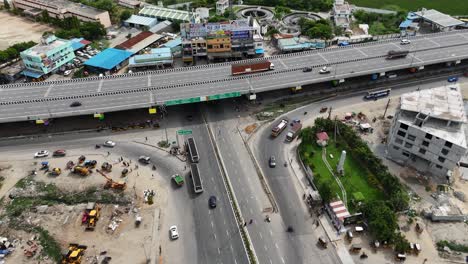 Elevated-footage-of-a-busy-intersection-with-traffic-signals-and-pedestrian-crossings