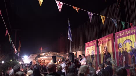 Crowd-gathered-to-celebrate-the-resurrection-of-Christ,-at-small-orthodox-church-in-Greece