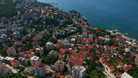 Aerial-tilt-shot-overlooking-the-coastline-of-Herzeg-Novi-in-sunny-Montenegro