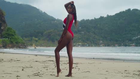 A-young-African-girl-in-a-bikini-enjoys-the-beach-on-the-tropical-twin-islands-of-Trinidad-and-Tobago