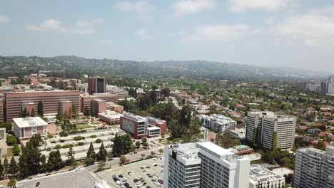 Los-Angeles,-California-Aerial-View-with-the-Hollywood-Hills-and-Beverly-Hills-in-the-Background-on-a-Warm-Sunny-Day