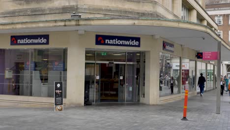 Exterior-facade-of-Nationwide-bank-with-people-passing-by,-Exeter-Devon-UK,-June-2024