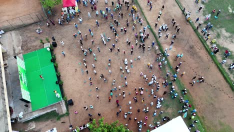 Aerial-Shot-of-People-Standing-In-Ground