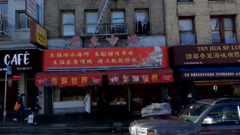 San-Francisco-Chinatown-Neighborhood,-Shops,-Restaurants-and-People,-View-From-Bus-on-Stockton-Street,-California-USA