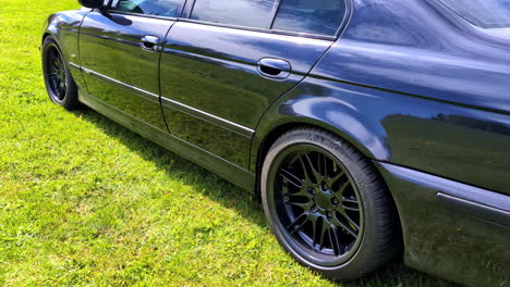 Close-up-of-the-black-BMW-M5-E39-reveals-a-sleek-and-sophisticated-design