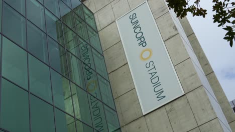 The-sign-of-Suncorp-Stadium-on-the-building-exterior-of-multi-purpose-stadium-in-Brisbane-city,-close-up-shot