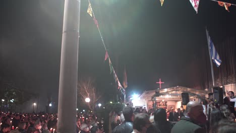 Crowd-gathered-to-celebrate-the-resurrection-of-Christ,-at-small-orthodox-church-in-Greece