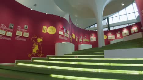 Staircase-with-Red-Wall-covered-in-Comic-Art-at-JC-Cartoon-Art-Museum