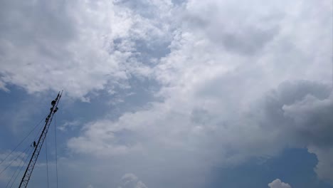 Telecommunication,-networking,-tower,-Time-lapse-of-nice-blue-cloud-moving-over-a-communication-tower