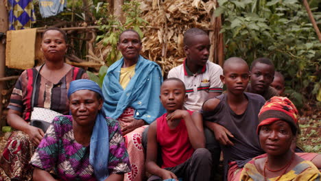 Close-up-shot-black-African-family-sitting-in-rural-countryside-in-Tanzania