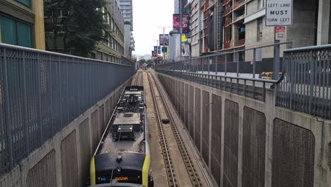 Los-Angeles-Metro-Train-Going-Underground-in-Tunnel-on-Figueroa-Street,-Blue-A-Line-Direction-to-Azusa,-California-USA