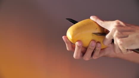 Hand-Cut-and-Carving-Ripe-Yellow-Mango,-Close-Up