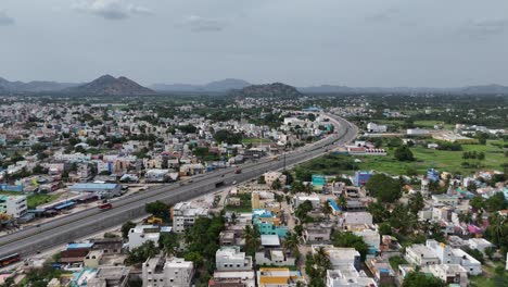 Aerial-shot-capturing-the-highway-through-a-vibrant-spring-landscape