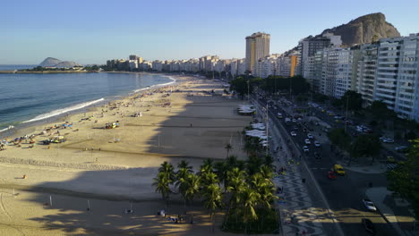 Aerial-view-over-the-promenade-and-the-Copacabana-Beach,-sunset-in-Rio-de-Janeiro