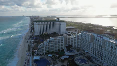 Evening-golden-hour-flight-over-Hard-Rock-Hotel-in-Cancun,-Mexico