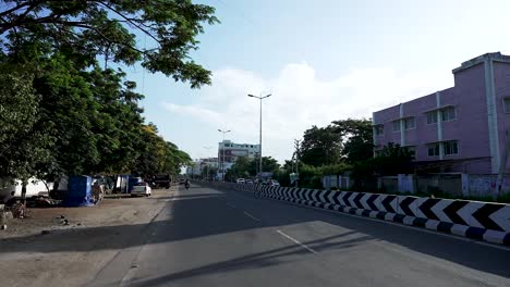 POV-driving-through-a-street-of-Coimbatore,-Tamil-Nadu