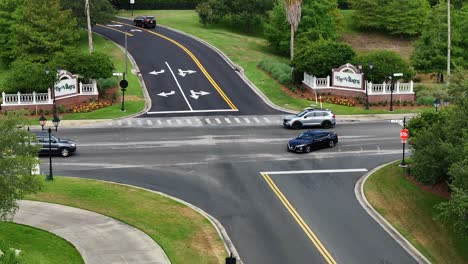 Golf-court-driving-on-sidewalk-of-luxury-suburb-with-Palm-trees