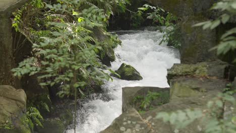 SLOW-MOTION-SHOT-OF-CUPATITZIO-RIVER-IN-URUAPAN-ON-A-CLOUDY-DAY