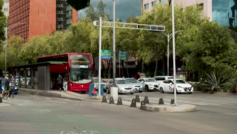 Barcelo-Reforma-Hotel-And-Obras-Cemex-Reforma-Building-On-Paseo-De-La-Reforma-Avenue-With-Metrobus-And-Cars-In-Street,-Mexico-City