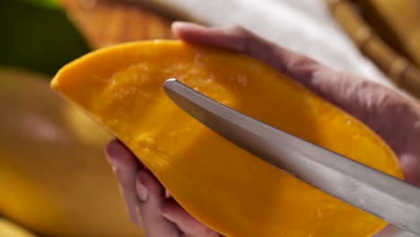 Hand-Cut-and-Carving-Ripe-Yellow-Mango,-Close-Up