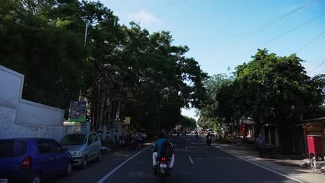 POV-driving-through-a-busy-street-of-Coimbatore,-Tamil-Nadu