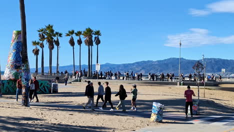 Crowd-of-people-enjoys-iconic-Venice-beach-of-Los-Angeles