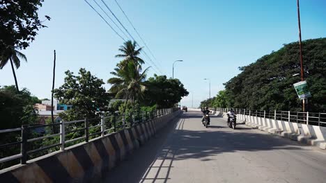 POV-driving-through-a-busy-street-of-Coimbatore,-Tamil-Nadu