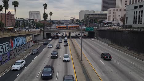 Los-Angeles-USA,-Busy-Traffic-on-US-101-Interstate-Highway-by-DTLA-Under-North-Spring-Street-Bridge