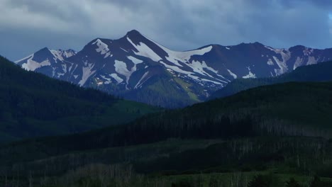 Mt-Sopris-Sopras-old-mount-Snowmass-Resort-Colorado-aerial-drone-sunset-Aspen-Wilderness-summer-June-July-Rocky-Mountains-peaks-landscape-sunny-blue-sky-Capital-Peak-circle-right-parallax-slowly