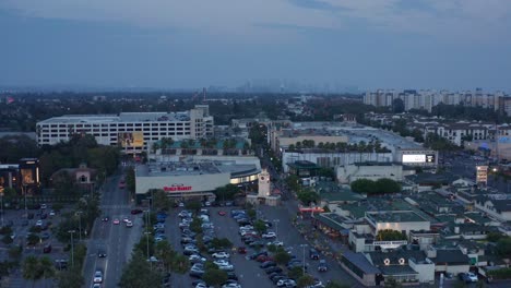 Wide-rising-aerial-shot-of-The-Grove-and-Farmers-Market-at-sunset-in-Los-Angeles,-California