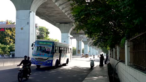 A-wide-shot-of-the-street-is-crowded-with-people-and-vehicles