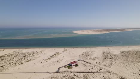 Aerial-view-of-Armona-Island-in-Olhão,-Portugal,-featuring-sandy-beaches-and-a-coastal-landscape