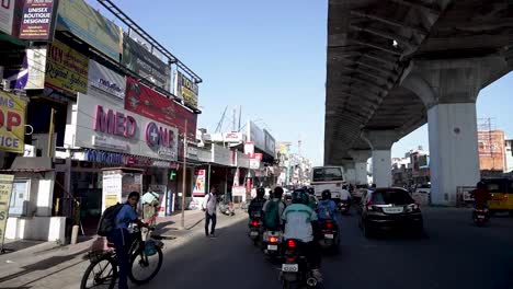 POV-driving-through-a-busy-street-of-Coimbatore,-Tamil-Nadu