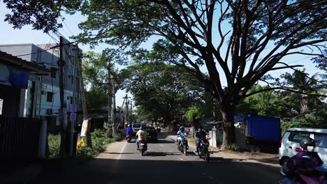 POV-driving-through-a-busy-street-of-Coimbatore,-Tamil-Nadu