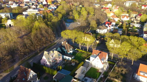 Aerial-View-of-Leafy-Residential-Neighborhood-in-Spring-during-golden-hour