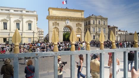 Slow-motion-shot-of-a-large-crowd-at-the-Olympic-torch-relay-at-the-Triumphal-arch