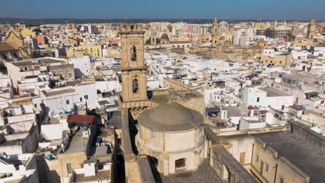 Aerial-View-Of-Cathedral-And-Villages-In-The-Town-Of-Monopoli-During-Daytime-In-Bari,-Italy