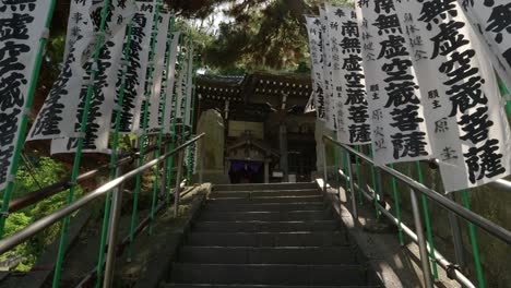 Slow-cinematic-walk-up-shrine-steps-in-Japan