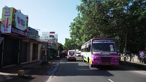 POV-driving-through-a-busy-street-of-Coimbatore,-Tamil-Nadu