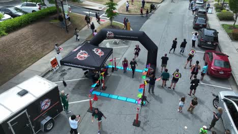 Aerial-top-down-of-runner-finishing-line-after-marathon-in-american-town