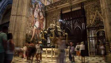 Timelapse-footage-of-visitors-exploring-Christopher-Columbus's-tomb-inside-the-Seville-Cathedral,-Spain