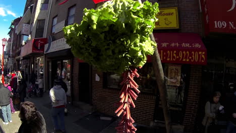 Cabbage-and-firecrackers-stand-ready-for-good-luck-blessing-during-Chinese-New-Year-celebration