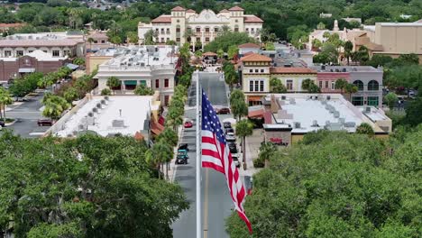 Proud-american-flag-in-front-of-main-street-in-The-Villages,-Florida