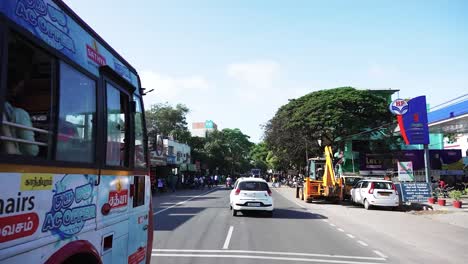 POV-driving-through-a-busy-street-of-Coimbatore,-Tamil-Nadu