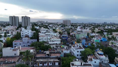 Elevated-view-of-Chennai’s-cityscape-in-the-evening,-featuring-illuminated-buildings-and-busy-streets