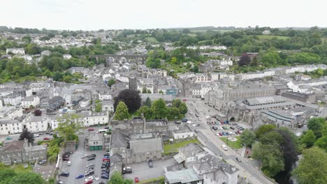 Aerial-view-of-Tavistock-market-town-with-historic-buildings-and-surrounding-greenery,-Devon,-UK