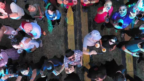 Aerial-view-of-crowd-people-watching-pop-rock-music-concert-while-drinking-soft-drinks-in-Mexico-City