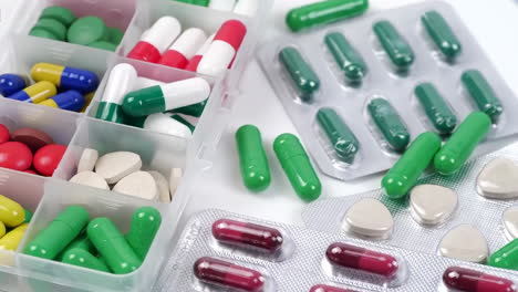 Antibiotic-drug-resistance,-many-colorful,-red,-yellow-pills-and-capsules,-packaging-with-medicines